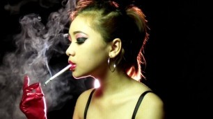 Young Asian Hottie Smoking in Shiny Outfit Long Gloves